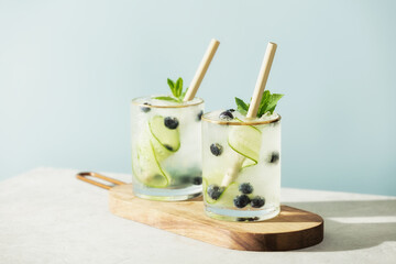 Trendy summer drinks with cucumber, mint and blueberry