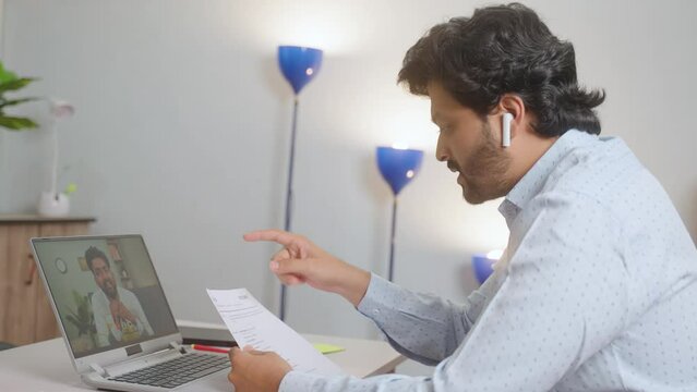 Side view shot of employee or manager taking virtual interview of applicant for company by seeing resume at office - concept of job consultation, employment, career workshop.