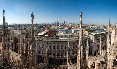 Milan from above. Panoramic view from Milan Cathedral to the historical city center and the business district in background. Travel to Italy.
