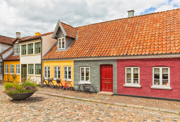 Fototapeta na wymiar Idyllic cobbblestone alley at the old town of Odense, Denmark