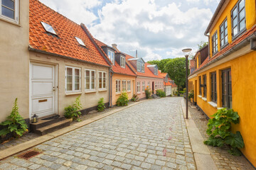 Idyllic cobbled street at the old town of Odense