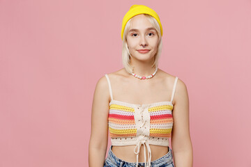 Young caucasian serious attractive blond lesbian woman 20s she wear colorful knitted top yellow hat...