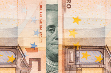 Stock exchange. Dollar and euro banknotes, close-up. Benjamin Franklin's sight between paper currency, vertical opening. Flat lay. The concept of the global crisis, investment and banking
