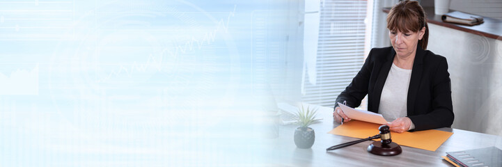 Female lawyer working on document; panoramic banner