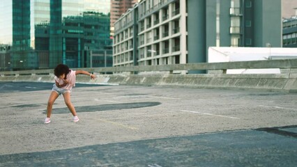 Afro street dancer or performer dancing energetic hip hop or breakdance choreography routine in a city. Cool, stylish and funky professional artist in edgy, expressive movement performance downtown