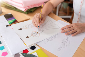 fashion designer stylish drawings sketches textile fabric material Costume. Designer creative workshop studio.