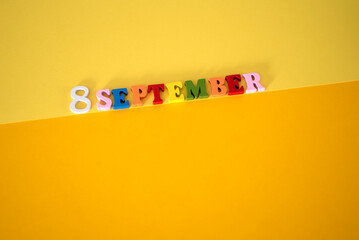 Calendar date of September 8 on a yellow background.