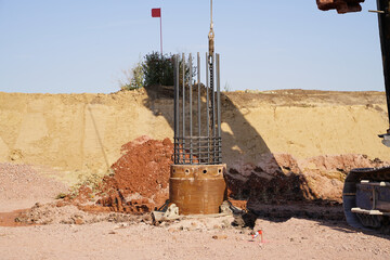 Inserting a reinforcing steel cage into the drill sleeve
