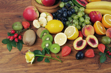 Fototapeta na wymiar A variety of fresh ripe fruits on a wooden table.
