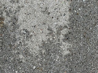 Close-up and selective focus of cement floor after rain.
