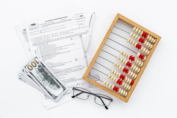 Business tax calculations with accounting wooden abacus