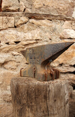 Blacksmith tools and actions forging iron objects.