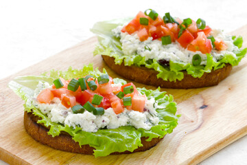 sandwich with tomatoes, green onions, ricotta cheese and fresh lettuce