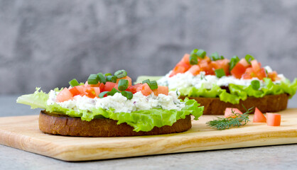 sandwich with tomatoes, green onions, ricotta cheese and fresh lettuce