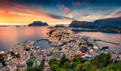 Picturesque summer view from flying drone of Alesund port. Great sunset in west coast of Norway, at...