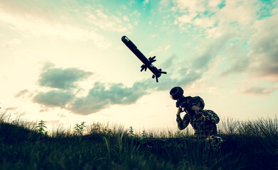 Fototapeta na wymiar Soldier firing anti-tank missile at war