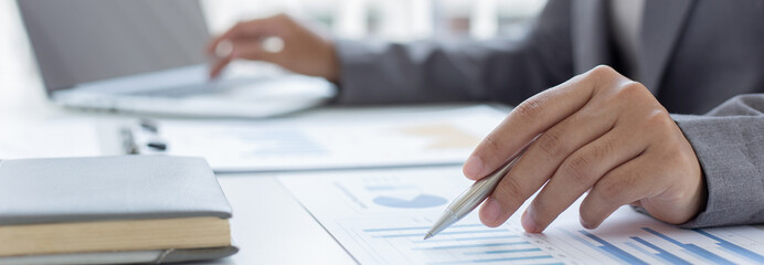 Businessmen analyze market data and calculate the cost of buying-selling products for a client's company, Professional marketing and financial accountants concept.