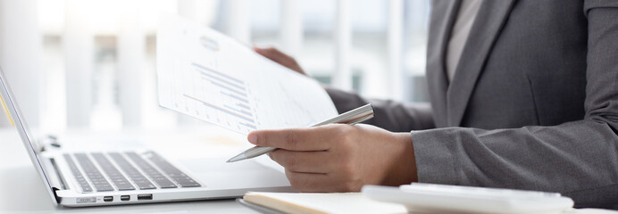 Businessmen analyze market data and calculate the cost of buying-selling products for a client's company, Professional marketing and financial accountants concept.