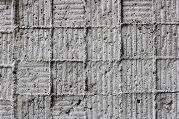Old cement background with traces of square tiles