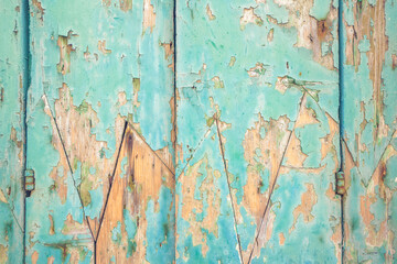 Wooden facade with peeling paint