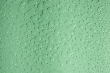 Olive or green background with water drops top view