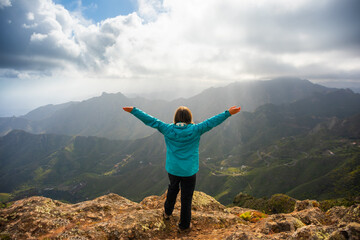 Sporty woman hiking in Anaga Mountains Taganana Tenerife, Canary island resort - obrazy, fototapety, plakaty