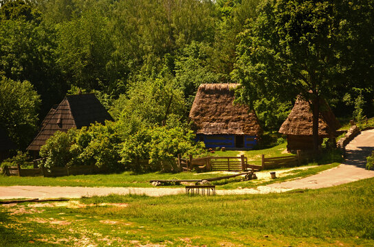 Old Ukrainian village. Rural summer landscape. Ukraine. National Museum of Folk Architecture and Life. Open-air museum. Thatched Roofs. The 60-80 years of Ukraine. The Carpathians. Folk Art.  