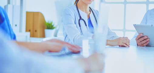 Doctors consulting with each other in a hospital conference room