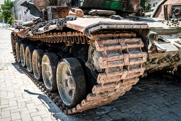 Fototapeta na wymiar Caterpillar of a broken russian tank