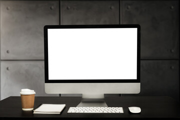 Close up view of  blank screen computer, office supplies and decoration on white desk with blurred modren office room background.