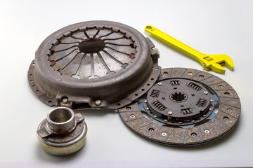 automotive parts and components of the clutch and drive system for completing mechanisms and repairing a car on a white milky background.