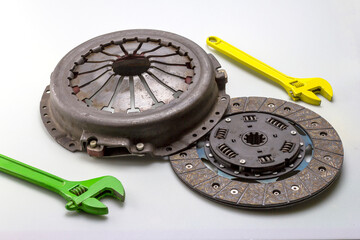 automotive parts and components of the clutch and drive system for completing mechanisms and repairing a car on a white milky background.