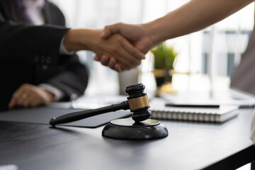 Handshake. Business people shake hands with lawyers contract legal cooperation agreement.