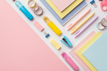 Back to school concept. Top view photo of colorful school supplies diaries correction pens stapler...