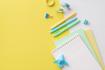 School accessories concept. Top view photo of school supplies copybooks airplane shaped sharpener colorful pens binder clips and adhesive tape on bicolor yellow and white background with copyspace