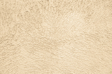 Beige background of the plastered wall. Close up.