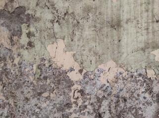 Concrete wall texture Grunge wall background.Grunge wall texture background. Paint cracking off dark wall with rust underneath.Cracked concrete wall texture background. Destructi