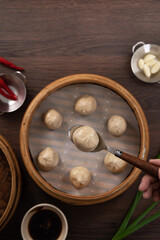 Obraz na płótnie Canvas Steamed pork soup dumplings named Xiao long bao xiaolongbao in Taiwan.