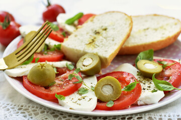 Fresh caprese salad with mozzarella and tomatoes