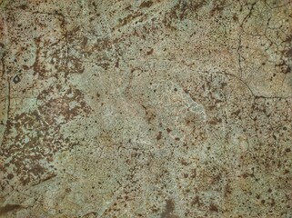 Abstract paint is peeling off the building wall.Close-up. Badly fixed building facade wall covered with cracks in stucco and paint. Missing patch of paint in the middle; crack with flappy.