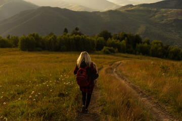 Freedom traveler woman on the top of mountains enjoy a wonderful nature. Yound girl on peak mountain with perfect view mountains. travel concept