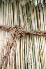 Japanese traditional straw Tied up 
 using palm rope method, close up detail photography.
