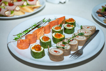 The banquet table. Tableware. Food, snacks, fruits, drinks