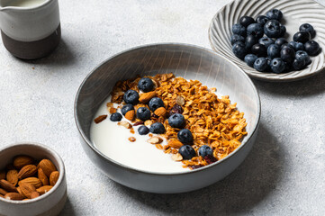 Oatmeal Granola with blueberry. Dry Breakfast. Healthy food or diet concept. Copy space. Granola with greek yogurt. Berry granola with almond. Healthy nutrition. Muesli with berries.