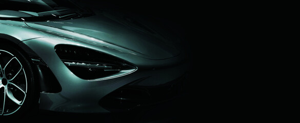 Detail on one of the LED headlights super car on black background free space on right side for text