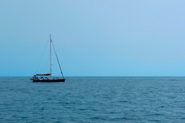 Single sailboat on the sea or ocean waters. Digital illustration