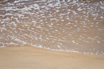 Sand beach and waves