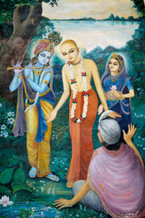 Obraz na płótnie Canvas Chaityana Mahaprahbu, a 15th century Vaishnava saint and social reformer- Vaishnava means venerating Vishnu or Krishna (Krishna, playing the flute on the left handside, is one of Vishnu's avatar)
