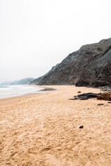 Fototapeta na wymiar Rocky cliff near rippling sea