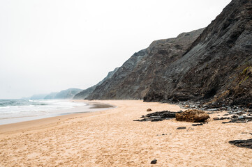 Rocky cliff near rippling sea